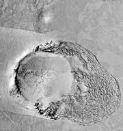 This feature, roughly 3 kilometres across, shows a rubble field pushed out from the right of a crater. This rubble looks like the piles of sea ice that form around islands in the Arctic and Antarctic.