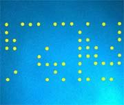 A grid of yellow dots, best seen under blue light, reveals the time and date that a document was printed.