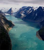 Greenland is melting: water streams from glaciers in the south.