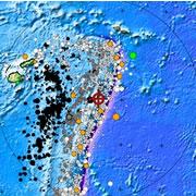 The epicentre of the quake (red cross), surrounded by previous quakes (circles, sized according to magnitude of the tremor). The coloured circles indicate quakes that have generated tsunamis, with orange meaning no damage was caused, green for local damag