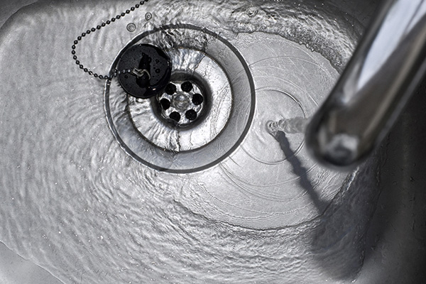 Water draining down a plughole