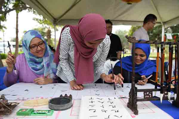 Students learn Chinese calligraphy at Suez Canal University in Ismailia, Egypt.