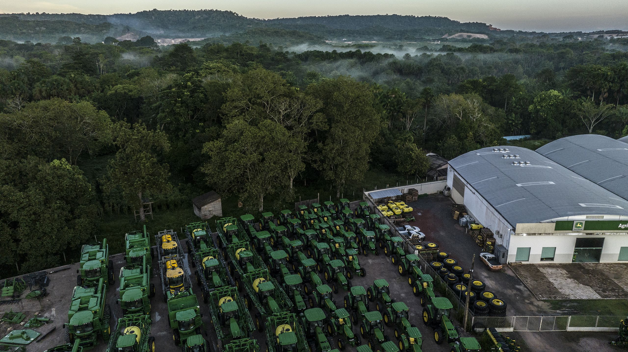 A John Deere dealership in front of the rainforest in the outskirts of Santarem, northern Para state in the Amazon rainforest in Brazil, May 9, 2023.