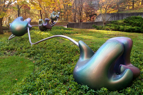 Photograph of garden artwork called ‘Waltz of the polypeptides’ by Mara G. Haseltine at Cold Spring Harbor Laboratory, NY, USA.