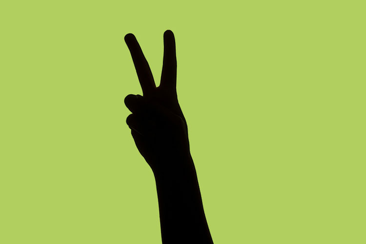 Silhouette of a victory sign