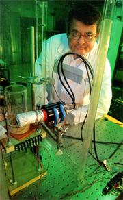 Rusi Taleyarkhan with his table-top fusion equipment in a lab at Oak Ridge, Tennessee, where he conducted research before coming to Purdue.