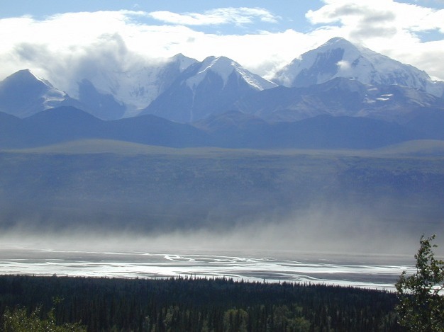 Dust (primarily silt particles) is entrained from the dry braid plain of the Delta River in Central Alaska.